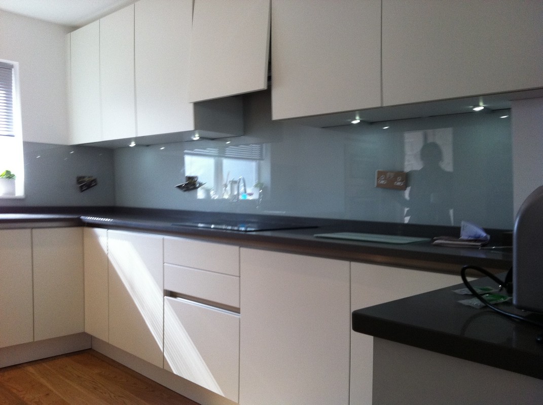 Grey glass kitchen splashback with LED lighting in Coulsdon
