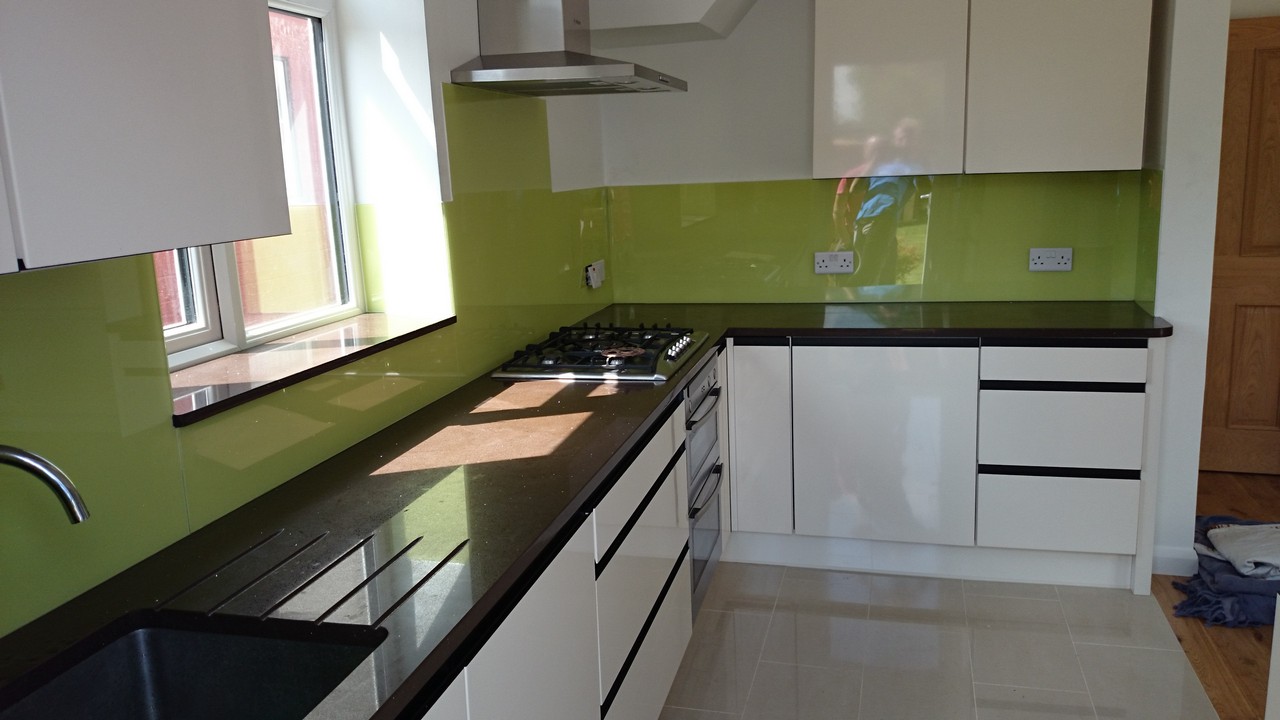 Lime green glass kitchen splashback installed by Coulsdon glaziers